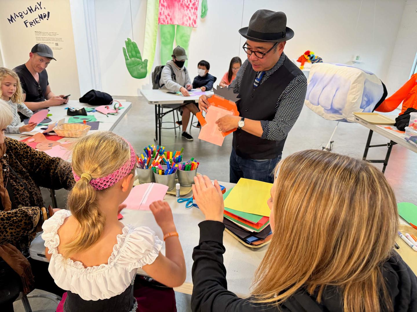 Teacher with children making art