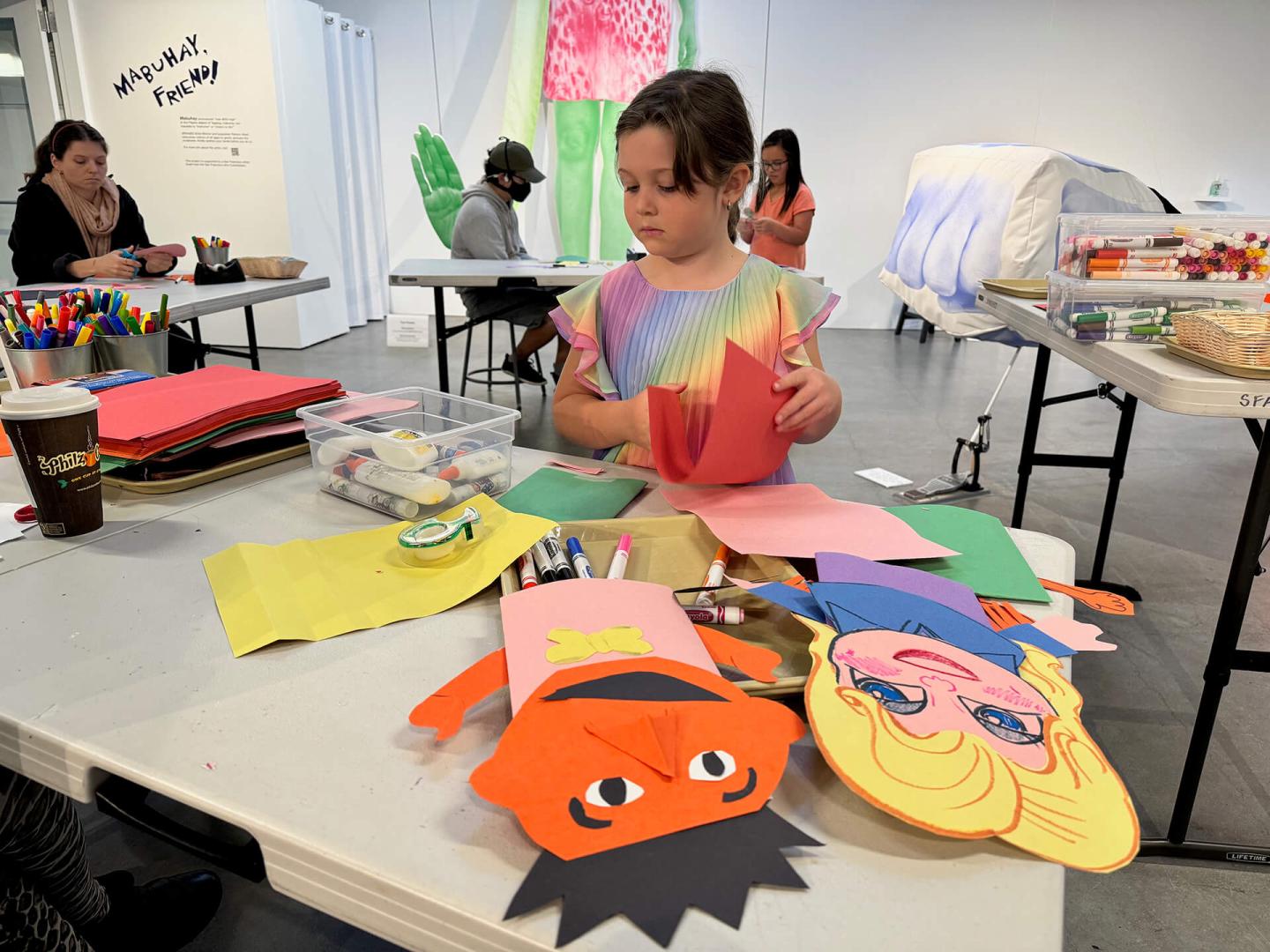 Child making a puppet