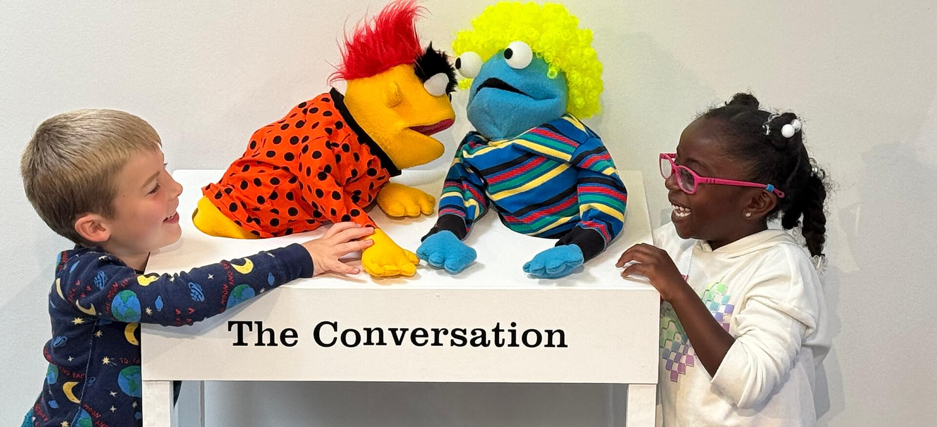 Children putting on a puppet show