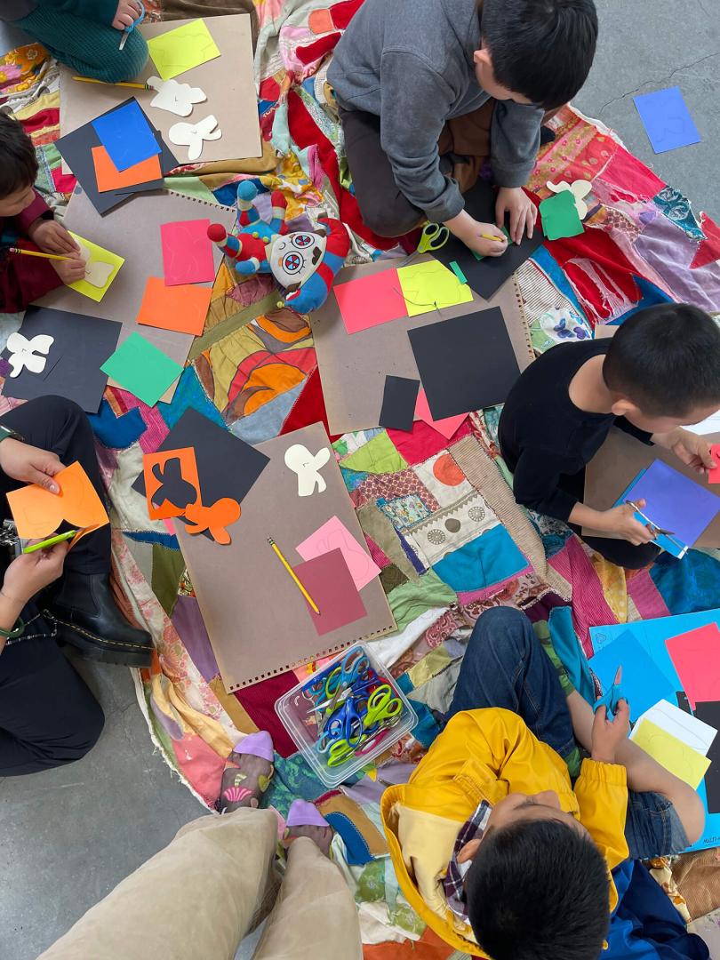 Children making a quilt
